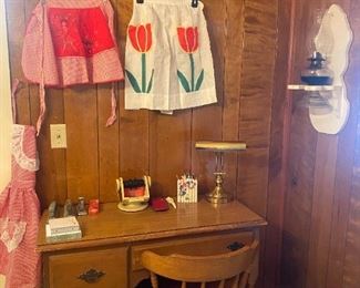 Vintage aprons and oil lamp