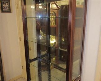 Mirrored, lighted curio cabinet