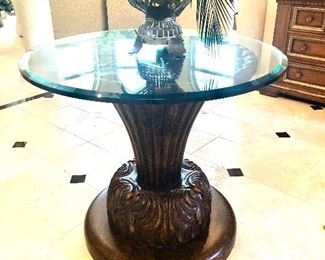 Statement carved base table from Noel furniture