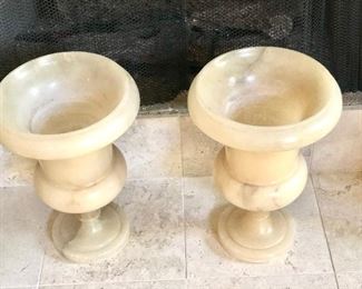Pair of cream alabaster urns