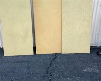 Three Pieces of particle board for shelving.