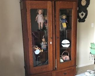 Antique curio cabinet, vintage clock