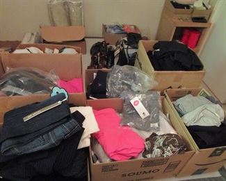 Boxes and boxes of new clothing most with tags