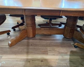 #59	Oak Rectangular Table w/2 leaves & 8 Heavy Wooden Chairs that slightly recline on Wheels w/Tan Padded seats & Back w/arms (arms on All Chairs) w/double pedistal Feet  70-103x48x29	 $375.00 
