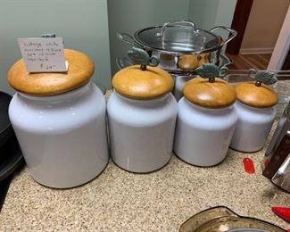 #80	Vintage White Cannister 4 pc. Set w/wood lids & Cast iron Leaf on Top	 $24.00 
