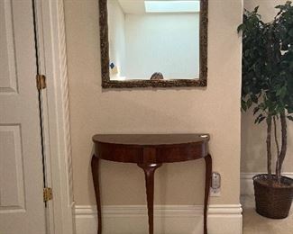 $280. Queen Anne style demi-lune table 31"w x 14"d x 28.5"h. attributed to Baker. Mirror sold in next photo