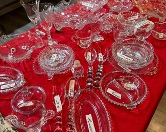 Table full of Candlewick including Stemware, Salad fork and spoon and many other pieces