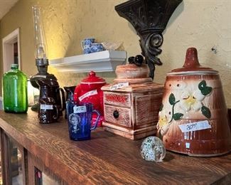 Several cookie jars and old green water bottle