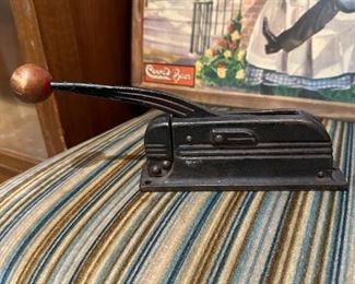 Old cast iron nut cracker with wooden ball handle