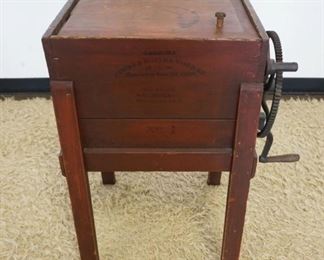 	ANTIQUE BUTTER CHURN IN OLD RED FINISH, MARKED SANBORN CHURN & BUTTER WORKER NO. 1 1865 WEST TOWNSEND VA, MISSING PADDLES. APPROXIMATELY 20 IN X 15 IN X 31 IN HIGH
