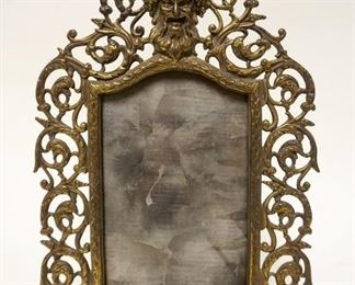 1144	ANTIQUE VICTORIAN ORNATE BRASS FRAME W/GORTESQUE FACE AT TOP, APPROXIMATELY 14 IN HIGH
