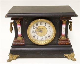 1148	INGRAHAM VICTORIAN MANTLE CLOCK IN BLACK WOOD EBONIZED CASE W/METAL MOUNTS & GARNITURES, APPROXIMATELY 7 IN X 16 IN X 11 IN HIGH
