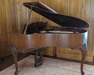 Vintage Wickham Baby Grand Piano. A lovely and elegant piece! There are some light scratches on the outer cabinet and unknown if was serviced/tuned recently. Measures 55” x 55”.