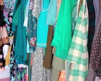 rack of green vintage clothing