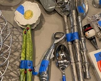 serving pieces including swordfish, bamboo style spoons and flower ceramic salad spoons....