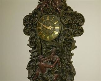 Wood wall clock with cherubs carved