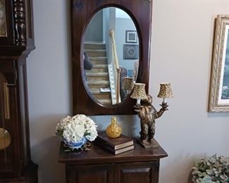 Foyer table and oval framed rectangle mirror