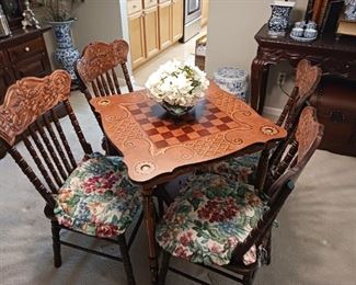Checkers or chess game board table with four chairs
