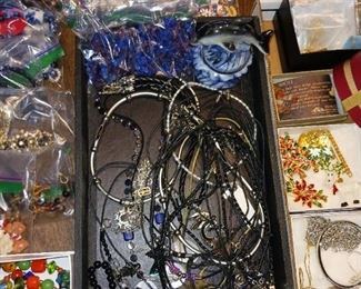 Costume jewelry necklaces and pins
