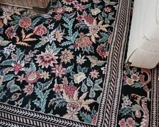 Decorative rug with black pink yellow and beige