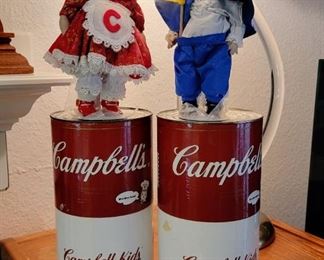 Collectible Campbell's Soup Kids with COA in large cans.