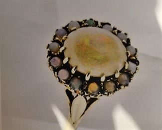 9k yellow gold opal ring surrounded by round opal cabochons