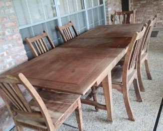 Large natural wood dining table with butterfly extension leaf and 6 chairs. Solid, gorgeous, & ready for a family to make this set all their own.