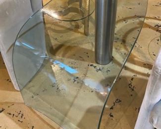 Vintage waterfall accent table with cylinder stainless steel tube leg.