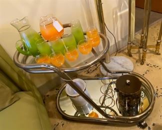 Vintage mid century modern 1950s lime green blendo  picture with glasses. Very unique mid century bar cart oval shaped two-tier mirrored bottom glass top.