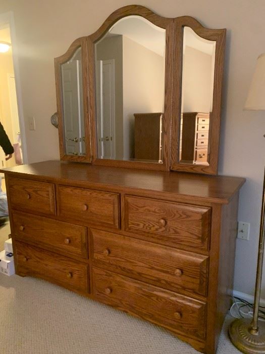 2110-1 and 2110-2   $1,750  Solid Oak Bedroom Set
Amish Made Shaker Dresser with Trifold Mirror, 7 drawers.  Measurements 63w 20d 32.5h, Mirror 50w 41.5h.  Nightstand with 3 drawers, matches dresser with mirror 24.5w 17.5d 25h.   Price is for both dresser with mirror and nightstand.  Sold separately:  Dresser and Mirror $1600,  Nightstand $500

