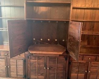 35-30 $1600 Ethan Allen Pine Wall Unit, 5 sections spanning 12’8” - there are 4 sections 32”w with 18d cabinet and 9d hutch/bookcase/shelf. One section is 24”w with 18d cabinet and 9d hutch/bookcase/shelf. The center section is 18.5”d and has a pull out section behind the top cabinet that swivels for up to a 32” tv and video components. It has vinyl record storage below. Each section is in 2 pieces with shelves on top and cabinets with shelf on bottom. Beautiful cabinets.