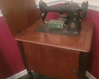 Antique Singer sewing machine and cabinet