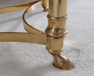 Oval Glass top coffee table with brass base