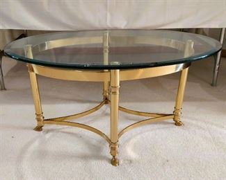 Oval Glass top coffee table with brass base