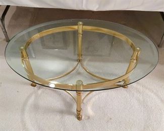 Oval Glass top coffee table with brass base