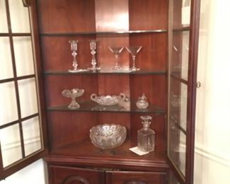 Baccarat Decanter and Martini Glasses, Waterford Candle Holders plus Vintage Cut Glass Pieces.      Corner Cabinet For Sale Too.
