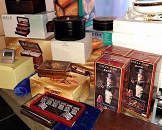 Much, much NIB, new in the box items. Uncle Sam cast iron banks, jewelry boxes