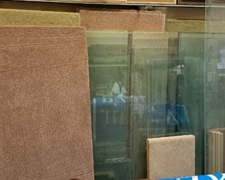 Much glass and wood shelving