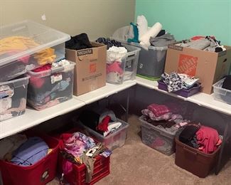 Boxes of blouses, shorts, pants, sweatshirts, workout clothes, scarves, and pajamas
