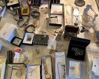 many watches and silver jewelry
