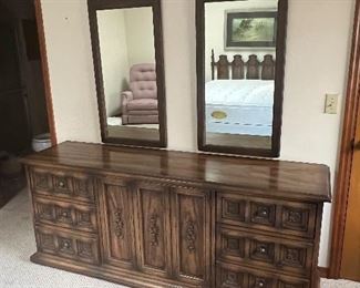 7 pc mid century modern bedroom set. Consisting of a double dresser with two mirrors, queen size headboard, 2 bedside tables and a gentleman’s dresser 
Available for presale for $700