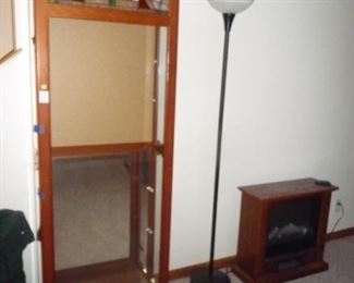 display / fireplace / very tall lamp