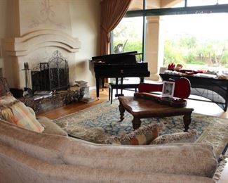 The Living Room with Yamaha Grand Baby Piano, Oriental Rug, Travertine Coffee Table