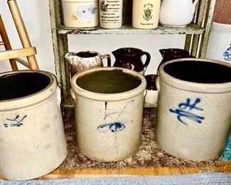 Three 4 gallon salt glazed crocks, 2 gallon butter churn without stopper, misc. stoneware pitchers, crocks