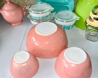 Nest of 3 pink Pyrex bowls, 3 Pyrex casseroles/baking dishes, Russell Wright divided bowl, Fiesta pink teapot (chips)