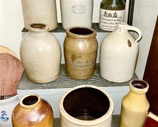 Close-up of jugs, jars, crocks, some with advertising (some items SOLD)