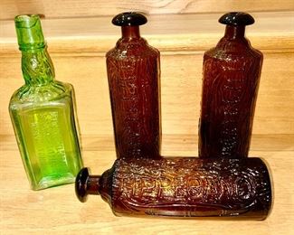 Antique green glass bottle "Dr. Loew's Celebrated Stomach Bitters & Nerve Tonic" and 3 Tippecanoe amber glass bottles (one SOLD)