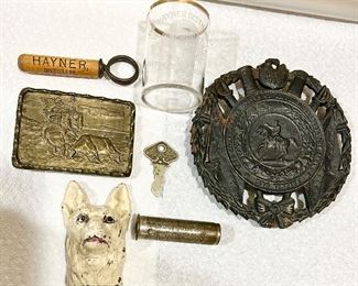 Antique Hayner, Distilleries cork screw (SOLD) and shot glass, vintage 1952 cast iron trivet (one of many), Ford #59 key, Firestone tire pressure, Hubley cast iron dog paperweight (SOLD)