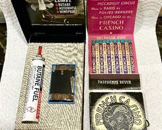 Ronson Comet lighter and butane fuel in original box, large advertising match books