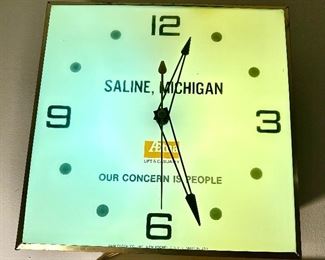 Vintage Aetna lighted electric wall clock with Saline, Michigan advertising